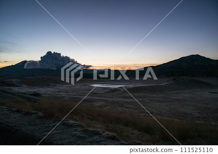 Beautiful scenery of volcanic smoke rising over Aso in early spring 111525110