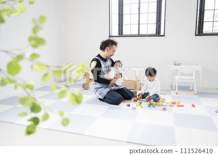 An image of a veteran childcare worker who looks like a school principal, an infant, and a baby 111526410