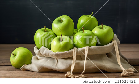 Bag made of natural fabric with green apples. Bag made of natural fabric with green apples. 111526421