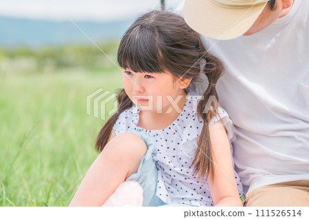A father holding a crying child (groggy, reluctant, moody) A father holding a crying child (groggy, reluctant, moody) 111526514