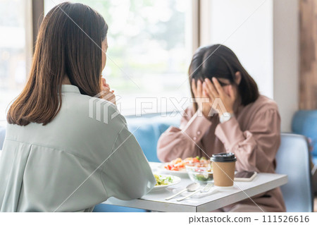 A woman listens to a crying colleague/female friend at a cafe (consultation, trouble, heartbreak, sexual harassment, harassment) A woman listens to a crying colleague/female friend at a cafe (consultation, trouble, heartbreak, sexual harassment, harassment) 111526616