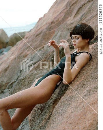 Summer Siren: A Sensual Journey of a Beautiful Bikini Model Posing on a Tropical Beach, Embracing the Sun-kissed Paradise. Summer Siren: A Sensual Journey of a Beautiful Bikini Model Posing on a Tropical Beach, Embracing the Sun-kissed Paradise. 111526866