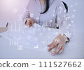 A woman organizing documents at her desk and business icons 111527662