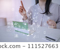 Business icon with a woman in a pointing pose looking at a passbook 111527663