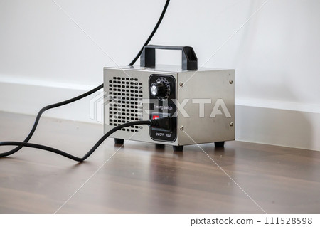 Ozone generator machine inside the room close up Ozone generator machine inside the room close up 111528598