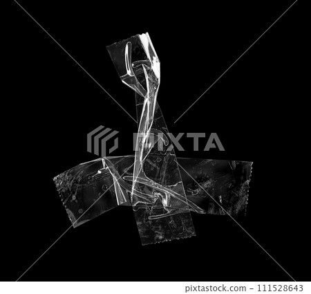 adhesive plastic tape isolated on black background 111528643