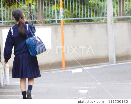 High school girl in a sailor suit on her way to school 111530180