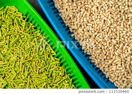 Pet litter tray with wooden filler on gray background 111530460