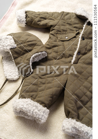 Gray quilted baby overalls for winter flat lay Gray quilted baby overalls for winter flat lay 111530564