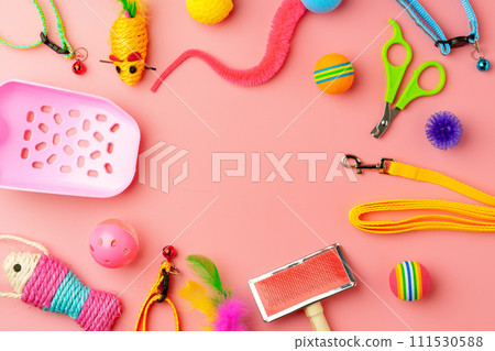 Pet toys on pink background studio shot 111530588