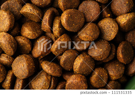 Dry pet food granules for background top view 111531335