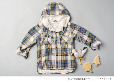Warm baby coat for boys on gray background top view 111531423