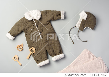 Gray quilted baby overalls for winter flat lay 111531487