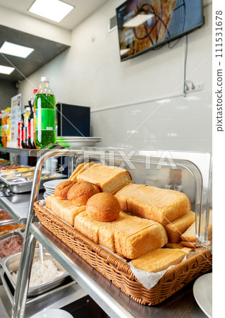 Bread box with fresh bread in a canteen Bread box with fresh bread in a canteen 111531678