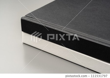 Blank notepad on gray background studio shot 111531797