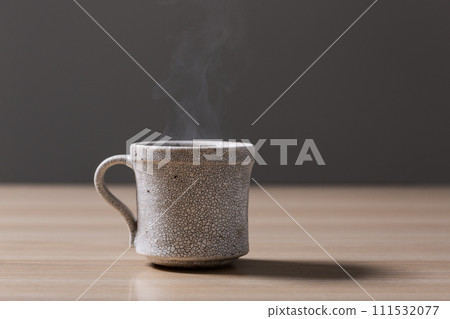 steaming coffee on the table steaming coffee on the table 111532077