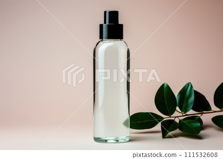 Transparent plastic cosmetic jar with a branch of green leaves 111532608