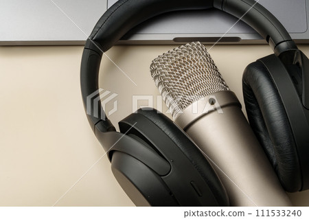 Headphones and microphone on the table close up 111533240