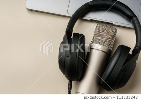 Headphones and microphone on the table close up 111533248