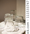glass cups arranged on cloth 111533747