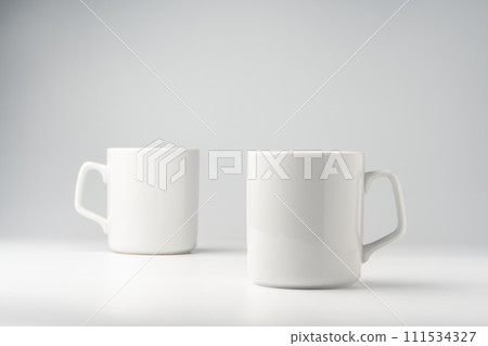 Blank white mugs mock up on white background 111534327