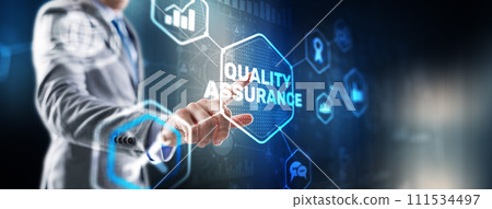 QA Businessman pressing Quality assurance button on virtual screens QA Businessman pressing Quality assurance button on virtual screens 111534497