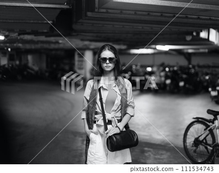 Stylish Lady Walking Alone in a Modern City, Exuding Beauty and Elegance Stylish Lady Walking Alone in a Modern City, Exuding Beauty and Elegance 111534743