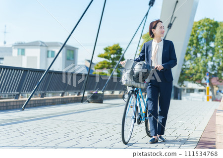 Business person commuting by bicycle 111534768