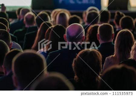 Audience listening attentively at a professional conference event 111535973
