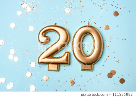 Gold candles in the form of number twenty. Gold candles in the form of number twenty. 111535992