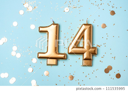 Gold candles in the form of number fourteen. Gold candles in the form of number fourteen. 111535995