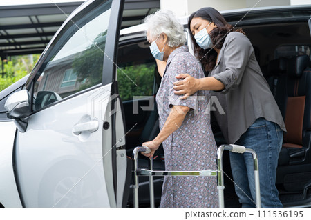 Asian senior woman patient sitting on walker prepare get to her car, healthy strong medical concept. 111536195