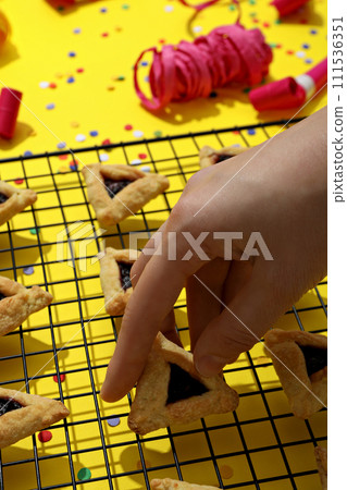 A mask with traditional cookies for the day of Purim. A mask with traditional cookies for the day of Purim. 111536351