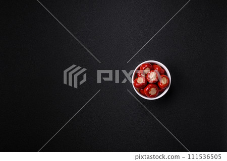 Red bell peppers stuffed with cheese or meat with salt, spices and herbs 111536505