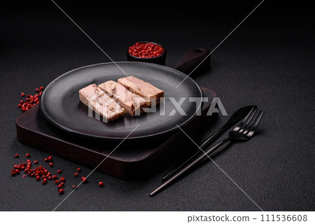 Delicious canned dietary tuna meat with salt, spices and oil 111536608
