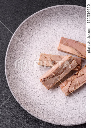 Delicious canned dietary tuna meat with salt, spices and oil 111536630