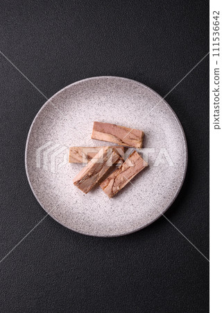 Delicious canned dietary tuna meat with salt, spices and oil Delicious canned dietary tuna meat with salt, spices and oil 111536642