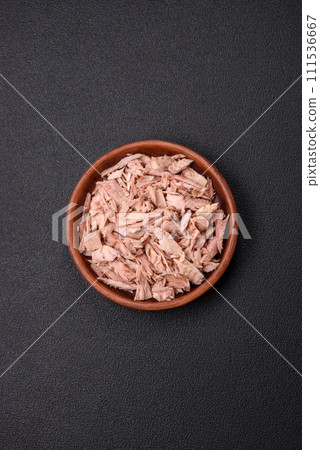 Delicious canned dietary tuna meat with salt, spices and oil 111536667