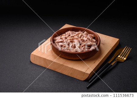 Delicious canned dietary tuna meat with salt, spices and oil 111536673