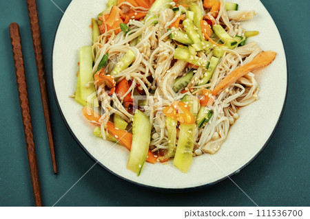 Salad with enoki or enokitake mushrooms. 111536700