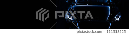 Front view silhouette of black modern car with headlights on black background. 111538225