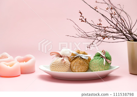 Eggs decorated with ribbons on a plate. Easter background Eggs decorated with ribbons on a plate. Easter background 111538798