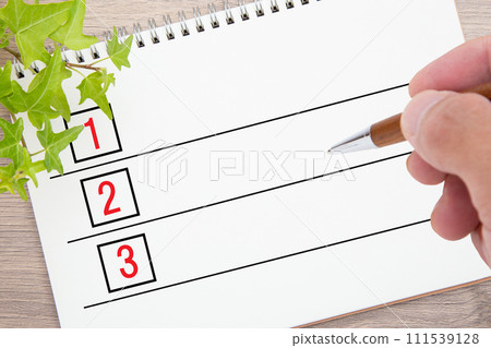 list and pen 111539128