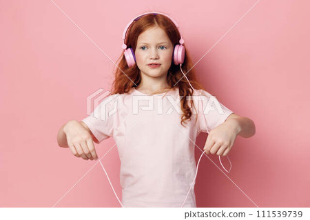 Listen entertainment childhood sound musical child small headphones little cute girl kid Listen entertainment childhood sound musical child small headphones little cute girl kid 111539739