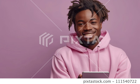 AI-generated content. Stylish African American teenager holding digital tablet and pointing to device advertising online learning isolated on light purple background wearing pink hoodie. AI-generated content. Stylish African American teenager holding digital tablet and pointing to device advertising online learning isolated on light purple background wearing pink hoodie. 111540722
