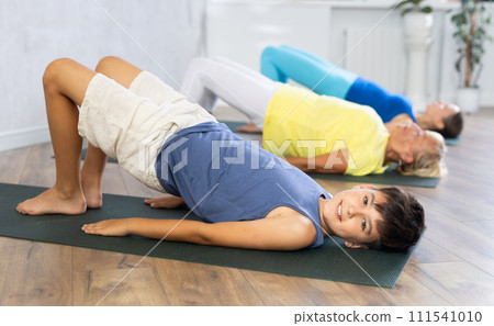 Family generation doing Half bridge pose. 111541010