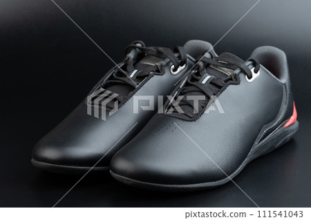Black slick pair of shoes 111541043