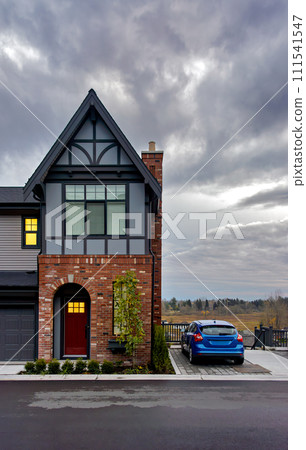 A perfect neighbourhood. Residential townhouse on later evening sky background 111541547