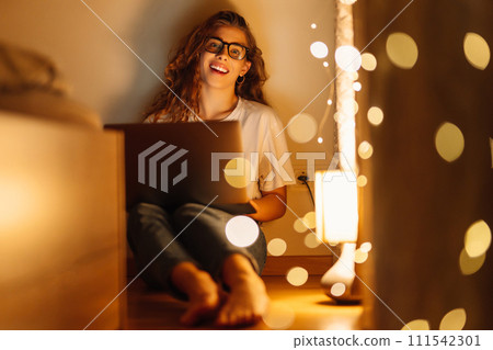 Woman working online on laptop computer at home. Business, blogging, freelance, education concept. 111542301