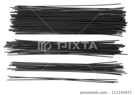 uncooked black spaghetti isolated on white background. Top view. Flat lay 111543071